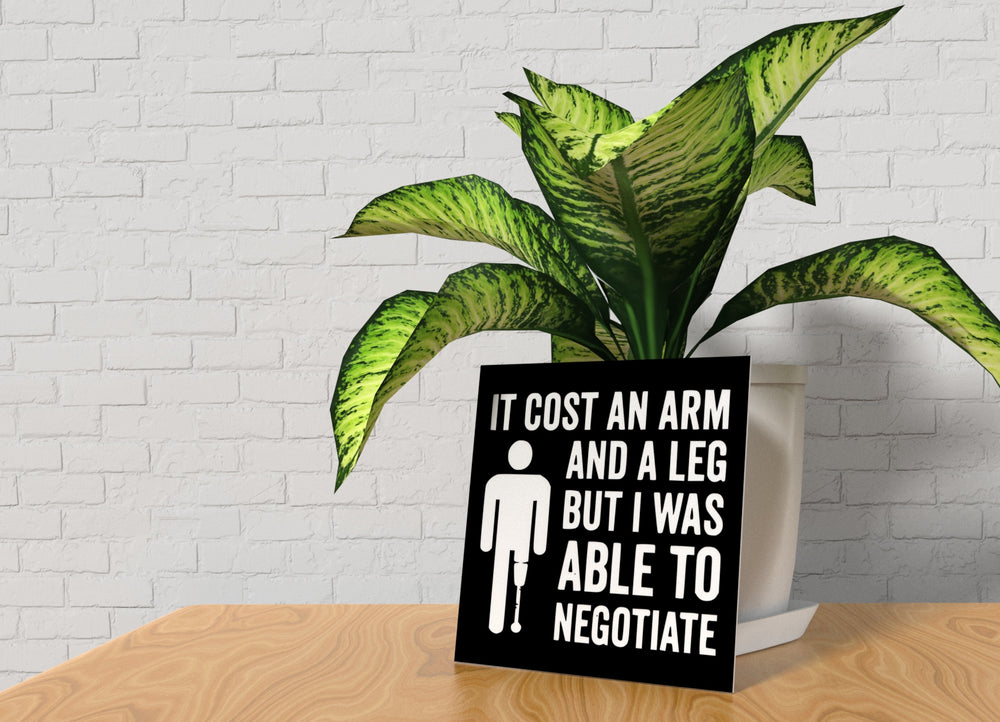 
  
  It Cost an Arm | Funny Sign for Home or Game Room Decor
  
