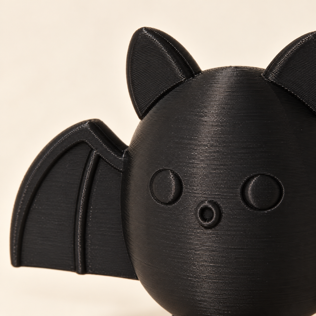 Close-up of the bat face, ears and wing detail