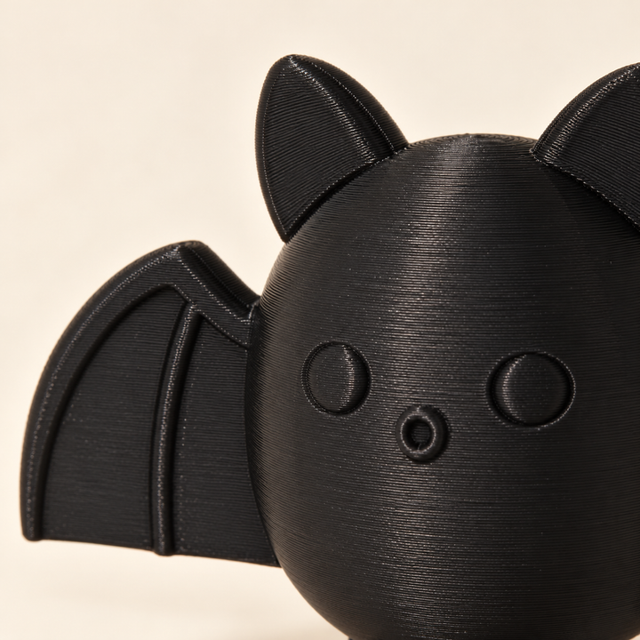 Close-up of the bat face, ears and wing detail