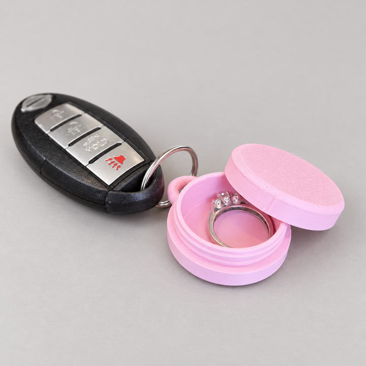 Ring holder keychain case opened to hold jewelry