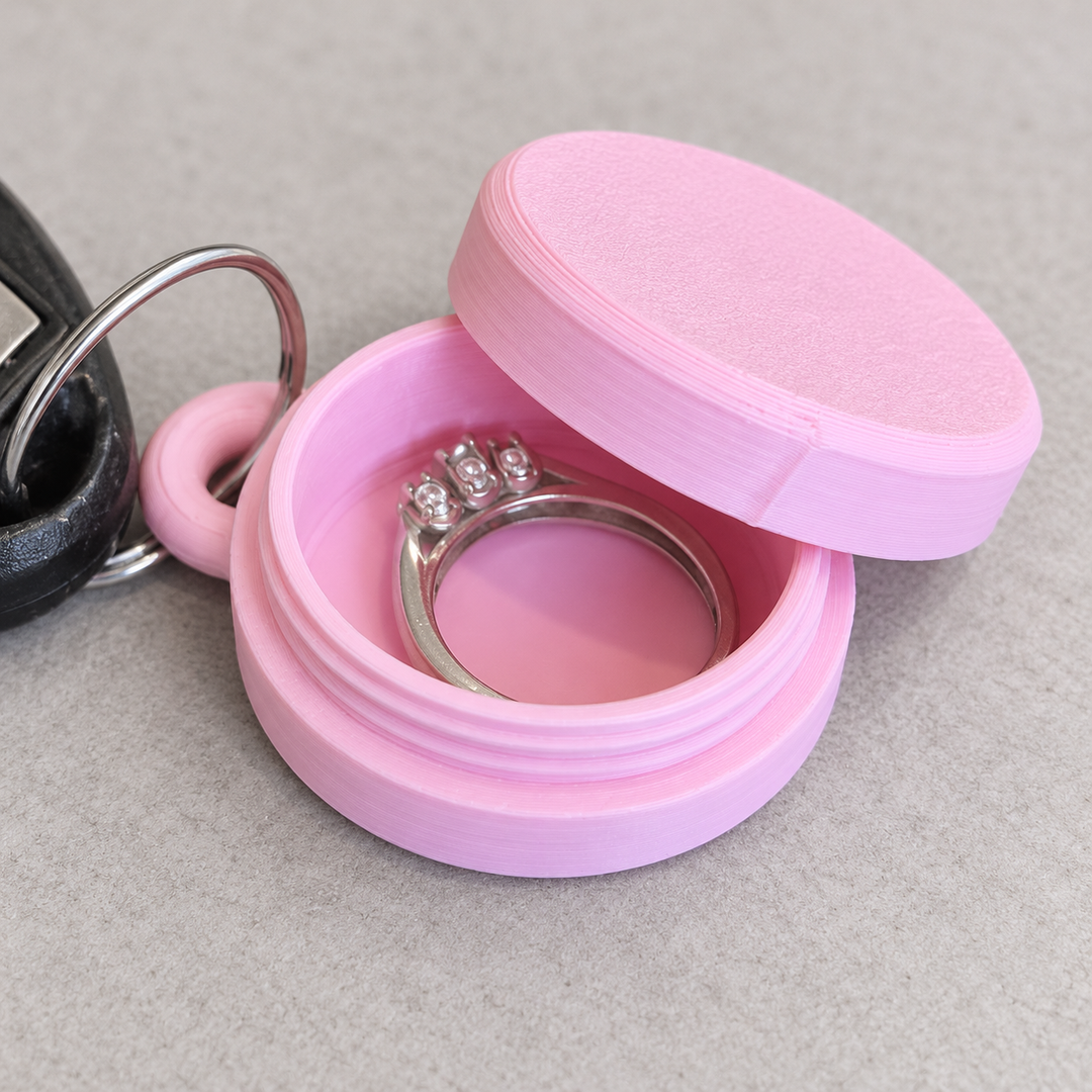 Ring holder keychain case opened to hold jewelry
