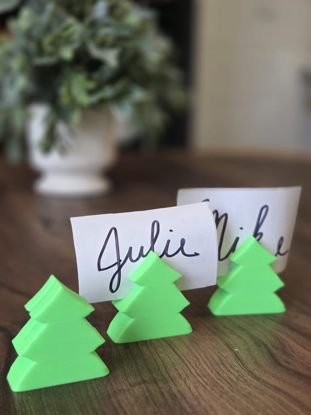Original photo of three actual tree-shaped holders displaying name cards; cards not included