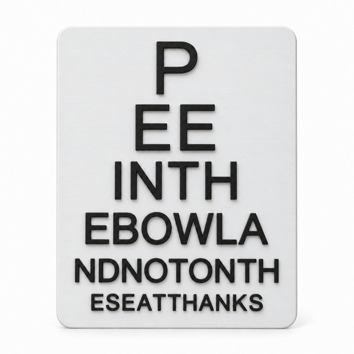 Funny bathroom eye chart sign with raised black letters on a white panel, front view