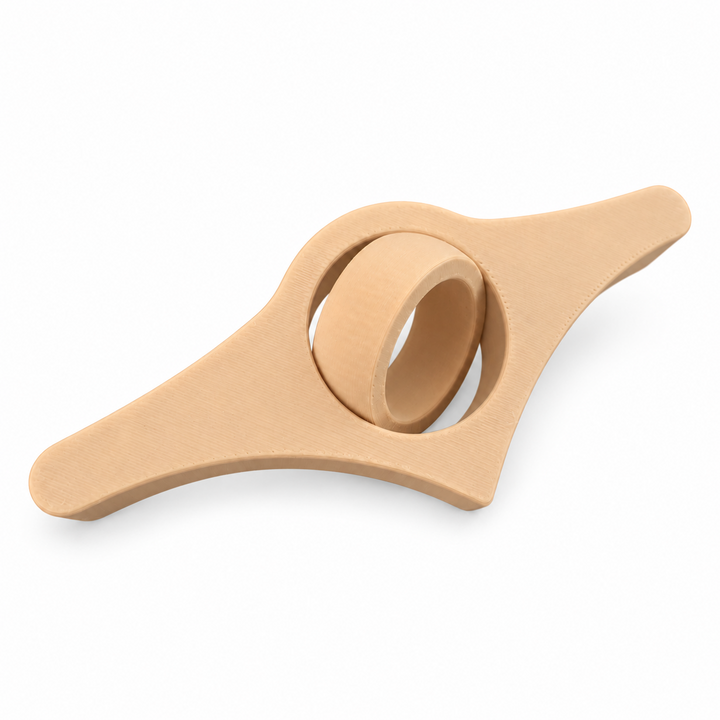 Light brown book page holder with rotating thumb ring on a white background
