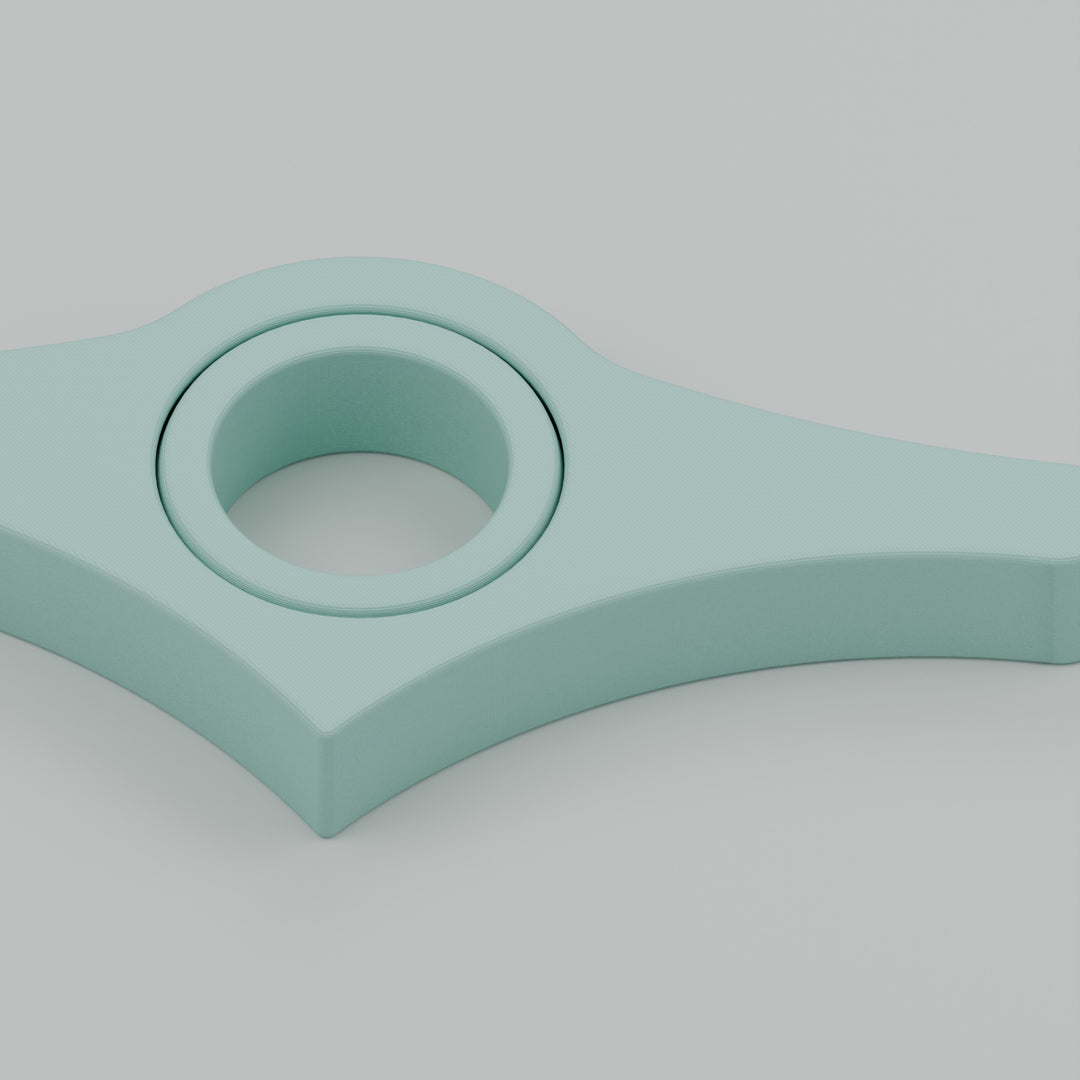 Close-up of the mint book page holder and central thumb ring