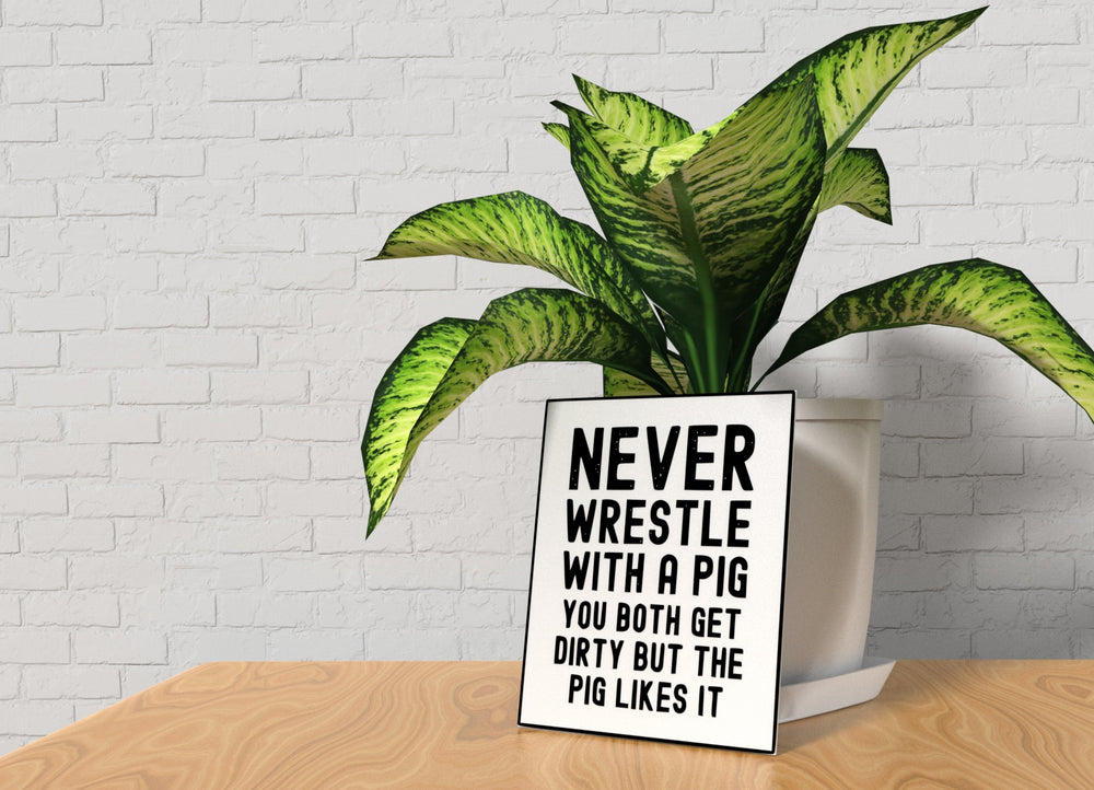 
  
  Never Wrestle with a Pig | Funny Sign for Home, Office, or Gift Decor
  
